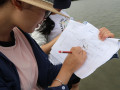Volunteer noting the monitoring parameters | Photo: Photo: Chunxia Jiang, Hainan University